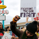 Cynthia Bailey pumps her fist outside the National Civil Rights Museum following the annual Martin Luther King Day march on January 16, 2017 in Memphis, Tennessee.